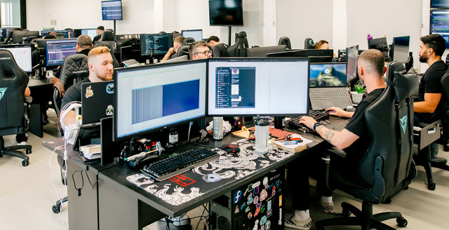 Open office with the team at their workstations